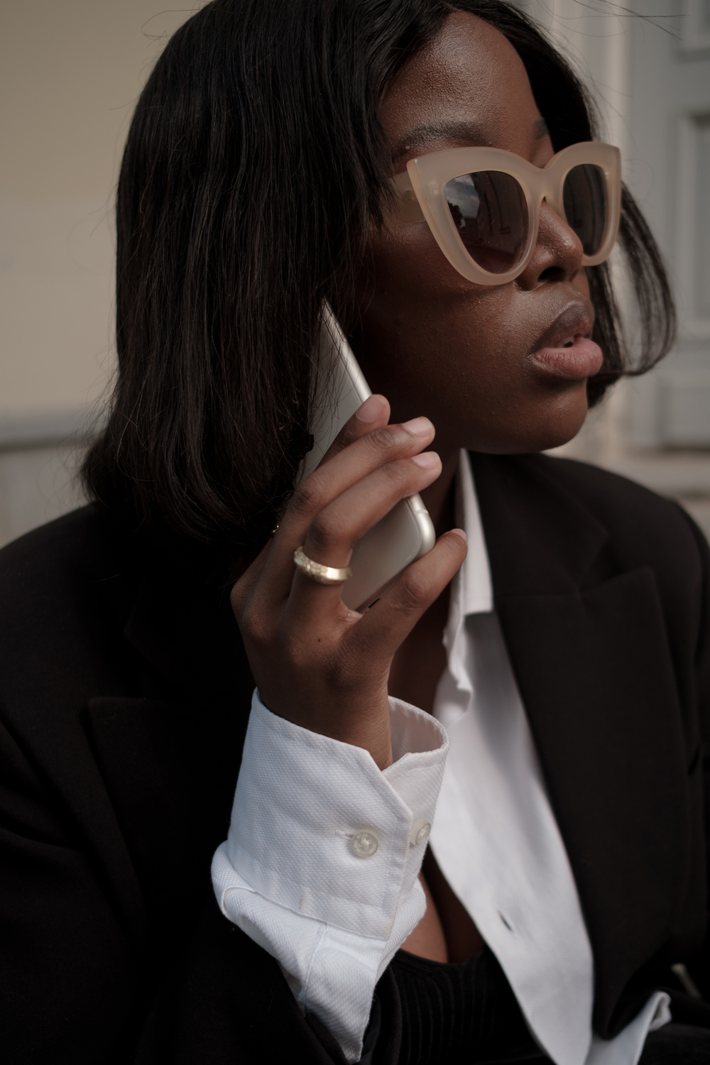 Woman in Business Outfit Talking on the Phone